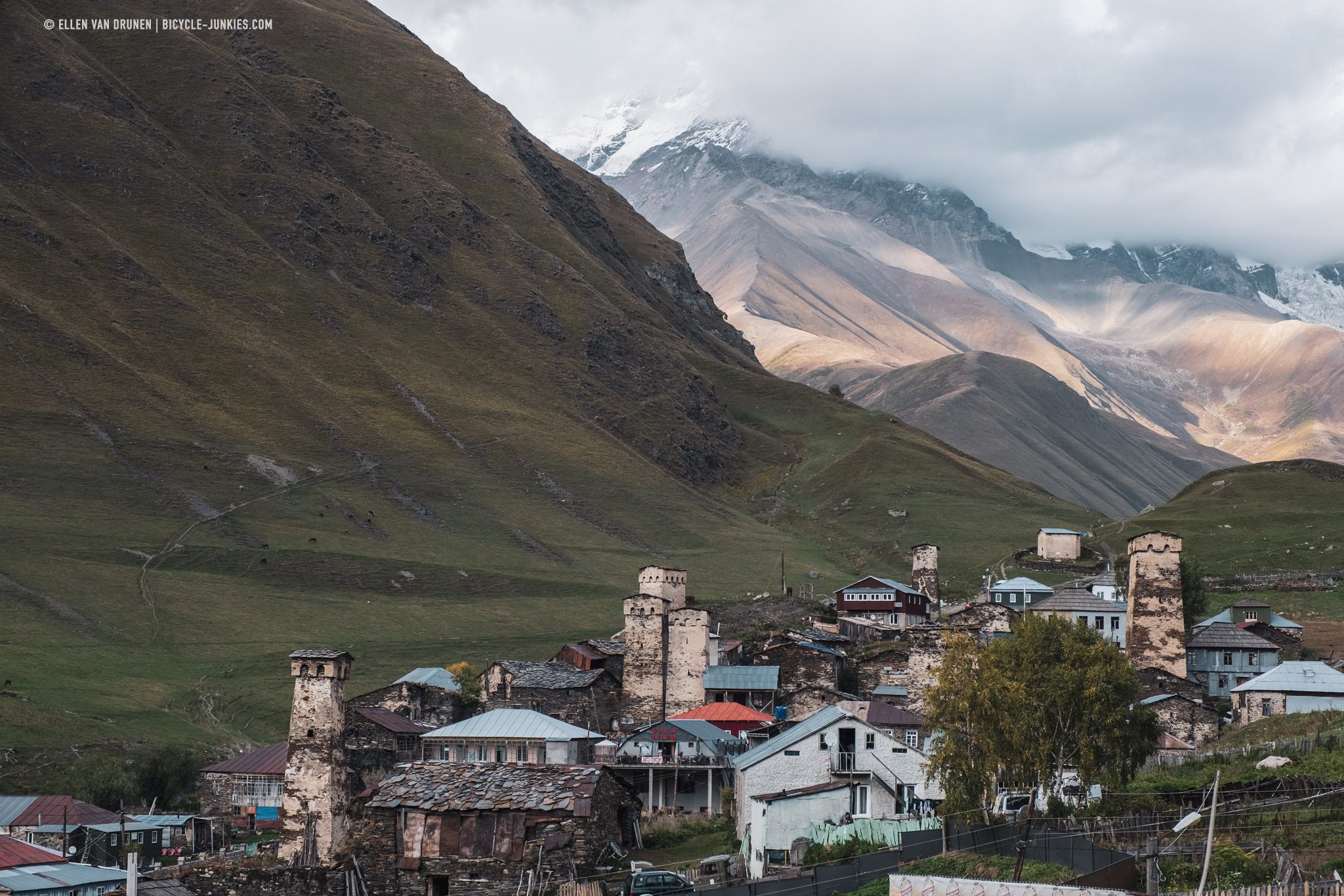 Upper Ushguli and the high Caucasus mountains behind the clouds